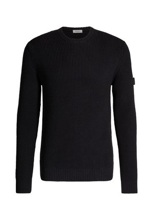 Pull noir à manches longues en maille avec col rond et poignets côtelés, présentant un motif gaufré texturé et un petit écusson sur la manche gauche.