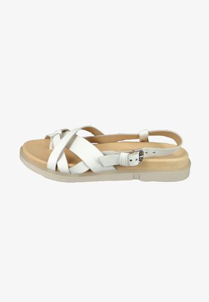 White leather sandal with crisscross straps, adjustable buckle, and a padded footbed on a light-colored outsole.