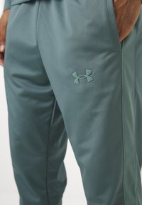 Under Armour RIVAL KNIT - Tracksuit - jasper blue/serpentine
