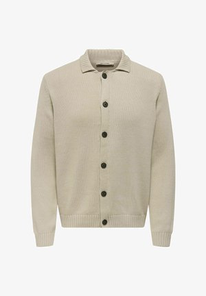 Cárdigan beige hecho de tela de punto texturizada, con un cuello con solapa y siete botones oscuros en la parte delantera. Puños y dobladillo acanalados.