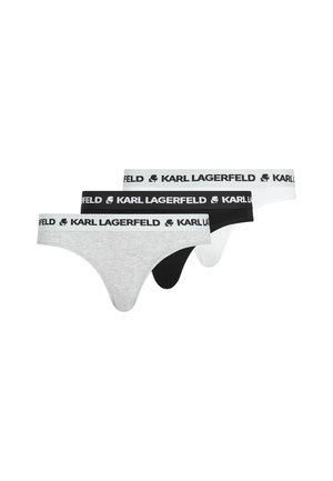 Drie paren stringondergoed in lichtgrijs, zwart en wit, met elastische banden met het "KARL LAGERFELD"-merk en een logo-accent.