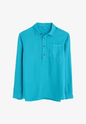 Turkizna srajca z dolgimi rokavi, ovratnikom, gumbni zapenjanjem in eno žepom na prsih. Narejena iz lahkotnega, teksturiranega materiala.