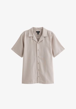 Chemise beige à manches courtes avec col camp et six boutons sur le devant, affichée sur fond blanc.