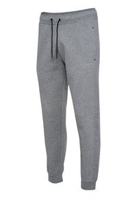 Pantalones deportivos grises ajustados con cordones negros, cintura elástica y tobillos con puños, diseñados para uso casual.