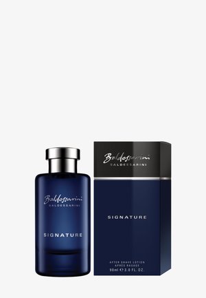 Dark blue Baldessarini Signature aftershave bottle with silver cap next to matching dark blue and black box.