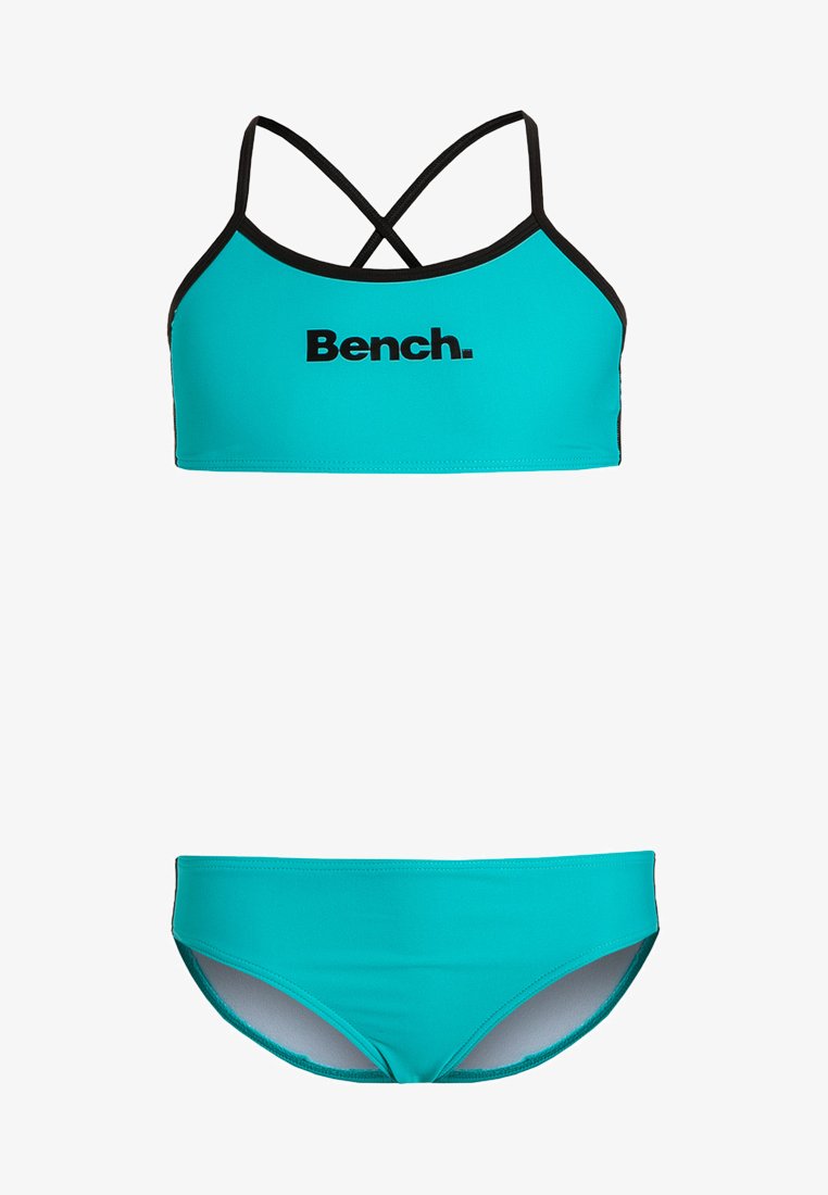 Teal plavkový set, ktorý obsahuje športovú podprsenku s čiernymi akcentmi a logom "Bench.", v kombinácii s vyhovujúcimi plavkovými nohavičkami. Hladká, elastická látka.