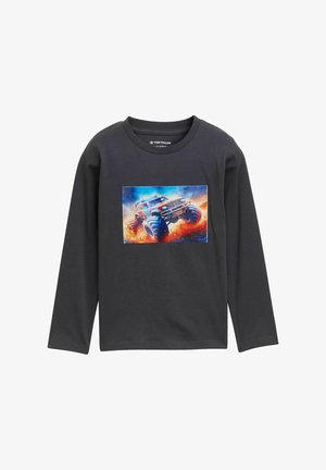 Dark gray long-sleeve shirt with a colorful graphic of a monster truck driving through dust and smoke on the front center.
