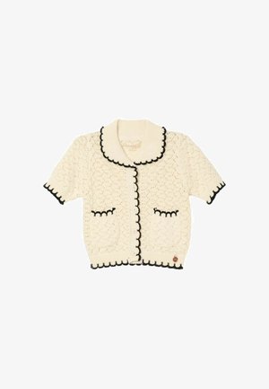 Kremfarvet kortærmet strikket cardigan med sort bølget kant, knapper foran, to forlommer og en bred ribstrikket krave.