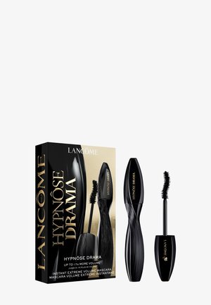 Mascara Lancôme Hypnôse Drama avec brosse courbée, emballage élégant noir et or, et texte promouvant un volume multiplié par 7.