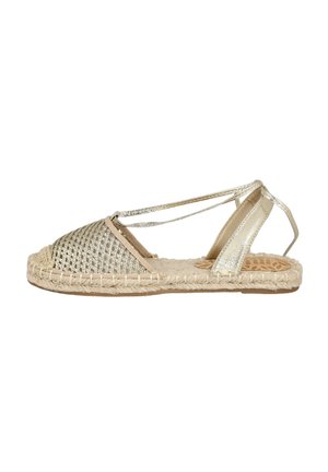 Sándala espadrille tejida en oro con una parte superior estampada, suela de yute y acentos de purpurina. Presenta tiras ajustables en el tobillo y una puntera redonda.