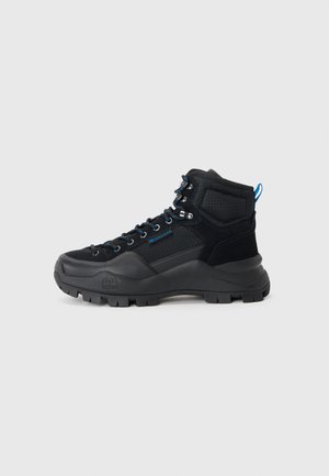 Black hiking boots with a combination of textured synthetic and mesh materials, featuring blue accents, metal eyelets, and a rugged sole.