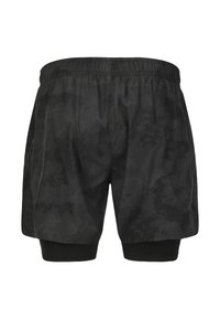 Svarta träningsshorts med en strukturerad design, elastisk midja och inre kompressionslager. Benlängden sitter ovanför knäet.
