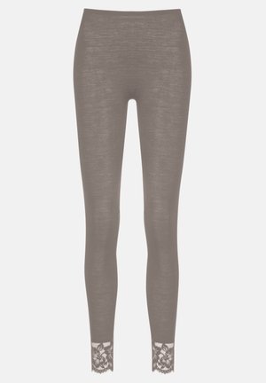 Brown leggings made of a textured fabric with floral lace trim at the ankle. Fitted design, smooth surface, and elastic waistband.