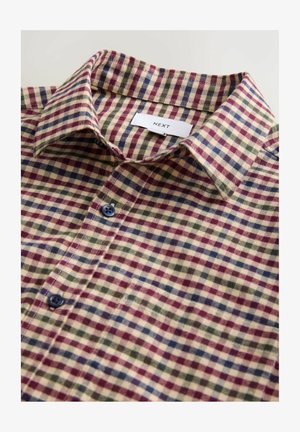 Gombos, galléros ing, bézs, piros, zöld és kék színű, több színű kockás mintával, a gallér belsejében jól látható "NEXT" márkajelzéssel.