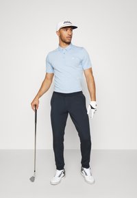 TravisMathew THE ZINNA - Pólóing - heather light blue