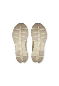 Lys beige skosåler med teksturerede mønstre, flexspor og et centralt udsnit for fleksibilitet. Holdbart gummimateriale.