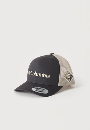 Casquette snapback Columbia noire et beige avec dos en mesh et patch logo sur le côté, présentée sur un fond clair uni.