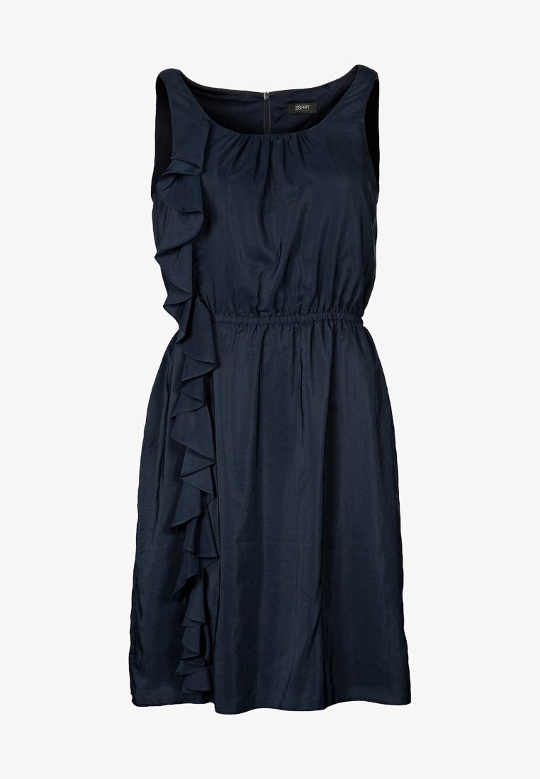 Robe sans manches bleu marine avec des détails froncés sur le côté gauche, taille élastique et texture de tissu lisse. Fermeture éclair au dos.