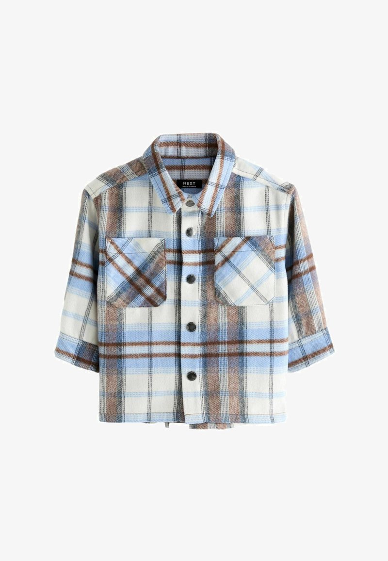 Camicia a bottoni in morbido flanella, con una stampa a quadri blu, marrone e bianco. Due taschini sul petto, maniche corte e colletto.