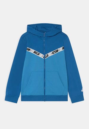 Sweat à capuche zippé bleu Nike avec une capuche, des poches avant et une bande logo Nike blanche et noire sur la poitrine.