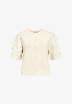 Cardigan crème à manches courtes avec un col rond, fermeture à boutons, bords côtelés et broderies florales sur les manches.