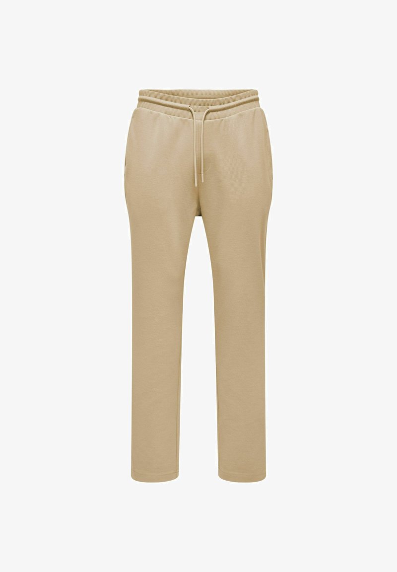 Beige Jogginghose mit elastischem Bund, verstellbarem Kordelzug und seitlichen Taschen. Sie zeichnet sich durch eine weiche Textur und einen geraden Beinschnitt aus.