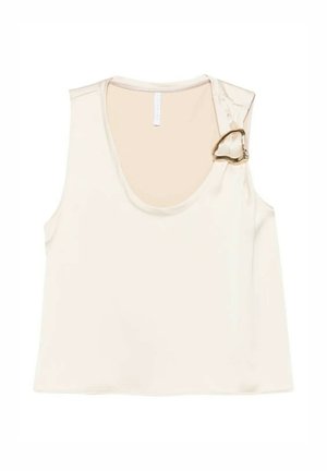 Top corto crema senza maniche con scollo rotondo e dettaglio di fibbia a forma di cuore dorata sulla bretella sinistra.