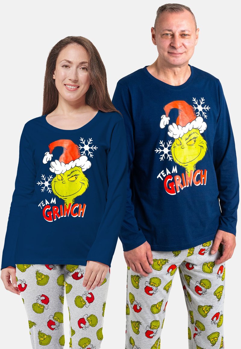 Magliette a manica lunga blu marino con grafica del Grinch e fiocchi di neve bianchi; pantaloni da pigiama grigi con motivi colorati del Grinch.