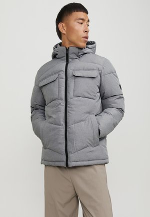 Gray puffer jacket with a zip closure, two chest pockets, and a hood. Textured fabric with a quilted design and black accents.
