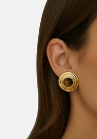 Gold circular earrings with layered spiral design and a central brown stone. Smooth texture and shiny finish.