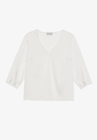 Blouse blanche avec un col en V, des manches longues bouffantes et une coupe décontractée. Confectionnée en tissu lisse, avec des détails de couture subtils.