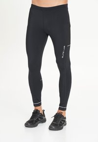 Schwarze, eng anliegende Sportleggings mit glatter Textur, ausgestattet mit einer seitlichen Netztasche und reflektierenden Akzenten entlang der Nähte.