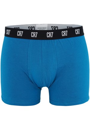 Blå boxer shorts lavet af blød bomuld, med en sort elastisk talje med hvid "CR7" branding. Glat overflade og tætsiddende pasform.