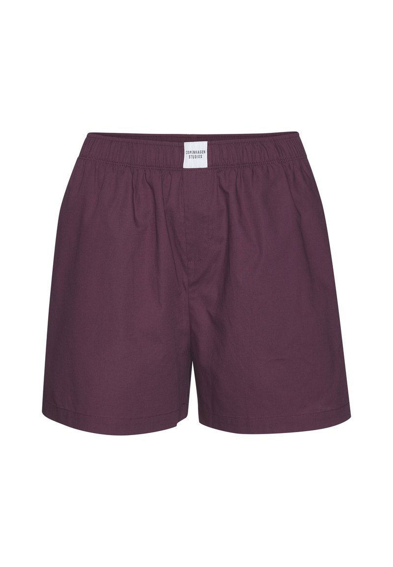 Bordo puuvillahousut, joissa on joustava vyötärö, minimaalinen ompelu ja pieni etiketti takana. Ei sivutaskuja tai kuvioita.