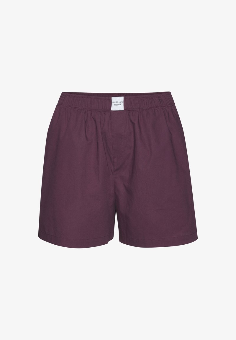 Bordo puuvillahousut, joissa on joustava vyötärö, minimaalinen ompelu ja pieni etiketti takana. Ei sivutaskuja tai kuvioita.