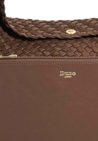Brown handbag featuring a woven texture on the flap, smooth leather body, gold hardware, and embossed branding at the bottom.