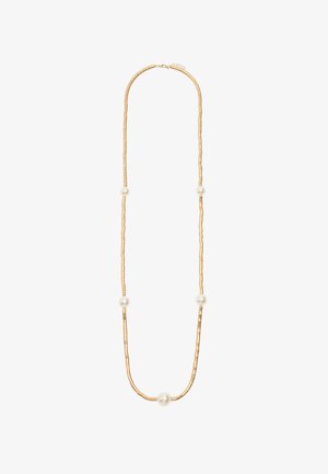 Naszyjnik w odcieniu złota wyróżnia się teksturowanymi, wydłużonymi ogniwami przeplatanymi trzema okrągłymi, białymi perłami. Posiada regulowany zapięcie na łańcuszku z tyłu.