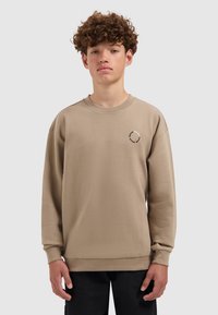 Lichtbeige sweatshirt met een ronde halslijn en lange mouwen. Voorzien van een klein gedrukt logo op de borst. Soepele textuur en een ontspannen fit.