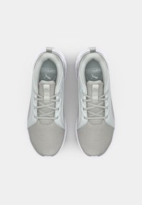 Light gray athletic shoes with a breathable mesh upper, padded collar, and soft sole. Features tonal laces and branding on the tongue.