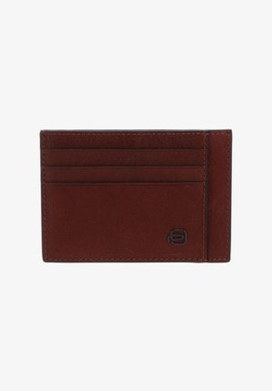 Brown leather cardholder with a smooth texture, featuring four card slots and a logo accent. Compact rectangular design.