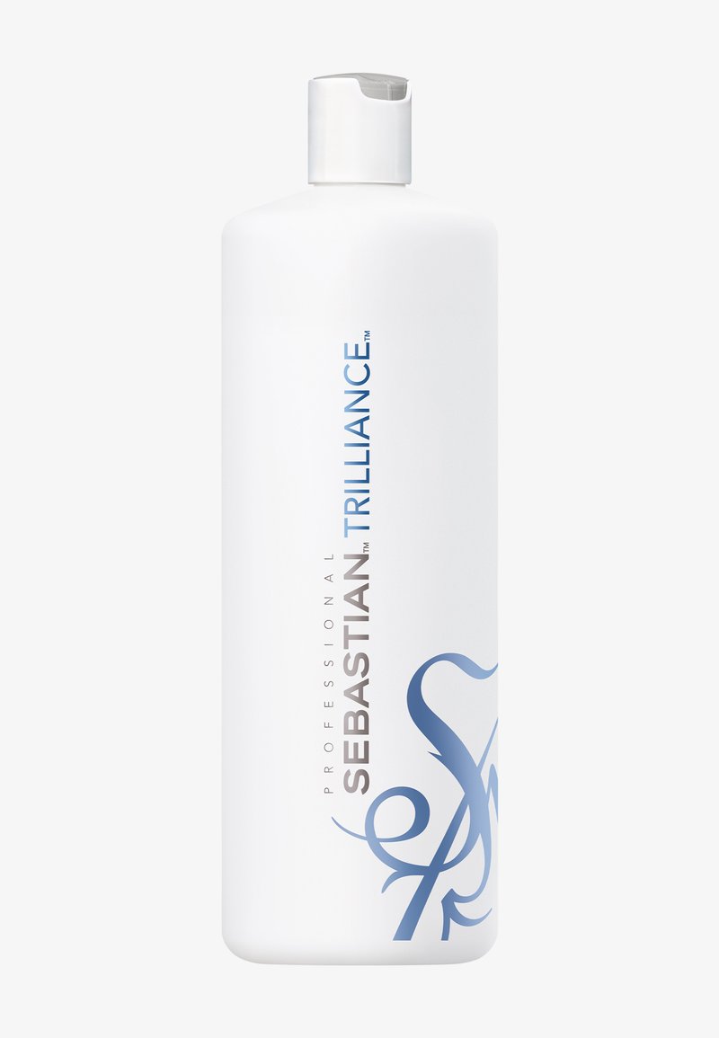 Bouteille en plastique blanc présentant une forme courbée, un bouchon à clapet, avec du texte bleu et argenté ; étiquetée "Sebastian Trilliance" pour un usage professionnel.