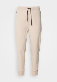 HADIKO  - Tracksuit bottoms - open beige