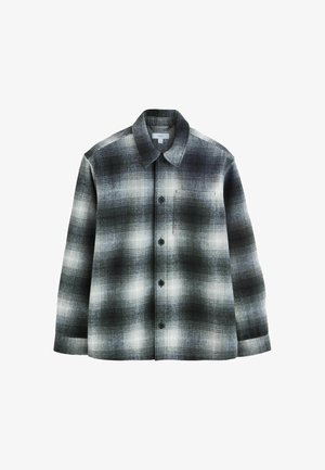 Sort-hvid ternet flannel skjorte med åben krave, lange ærmer, knaplukning og en brystlomme. Blødt, struktureret stof.