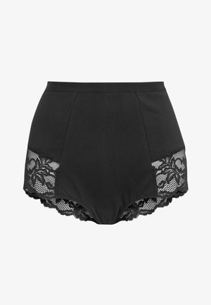 Augsti jostas melni apakšveļa ar mežģīņu dekoriem malās, kurai ir ziedu raksts un viļņotas malas. Gluda auduma tekstūra.