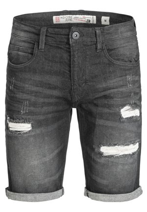 Donkergrijze denimshorts met rafelige, beschadigde stukken. Opgerolde cuffs en een vijf-pocket ontwerp. Katoenen stof met lichte textuurverschillen.