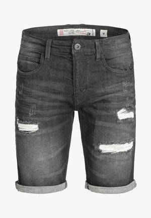 Donkergrijze denimshorts met rafelige, beschadigde stukken. Opgerolde cuffs en een vijf-pocket ontwerp. Katoenen stof met lichte textuurverschillen.