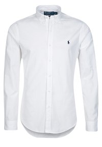 Weißes Baumwoll-Hemd mit klassischem Kragen und abgerundetem Saum. Mit kleinem marineblauem Logo auf der linken Brust und geknöpften Manschetten.