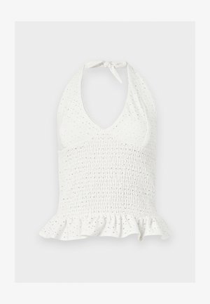 Haut blanc sans manches à col licou avec texture œillet, taille froncée et ourlet volanté.