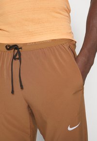 Nike Performance ELITE - Calças - ale brown/silver