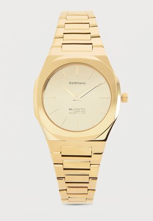 Gold-tone metal wristwatch with minimalist dial, thin hour markers, three hands, and linked bracelet band.